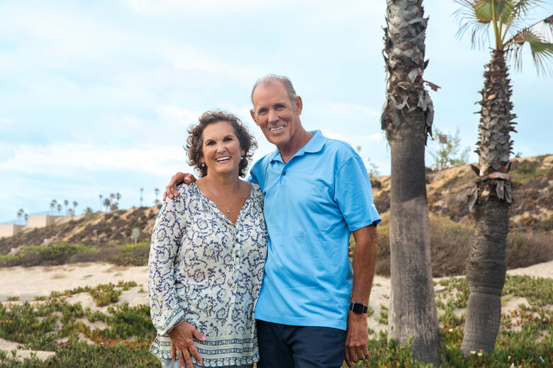 Lifestyle WhiteCouple LookingatCamera PalmTrees